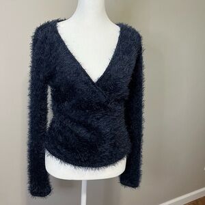 Soft fuzzy wrap sweater.